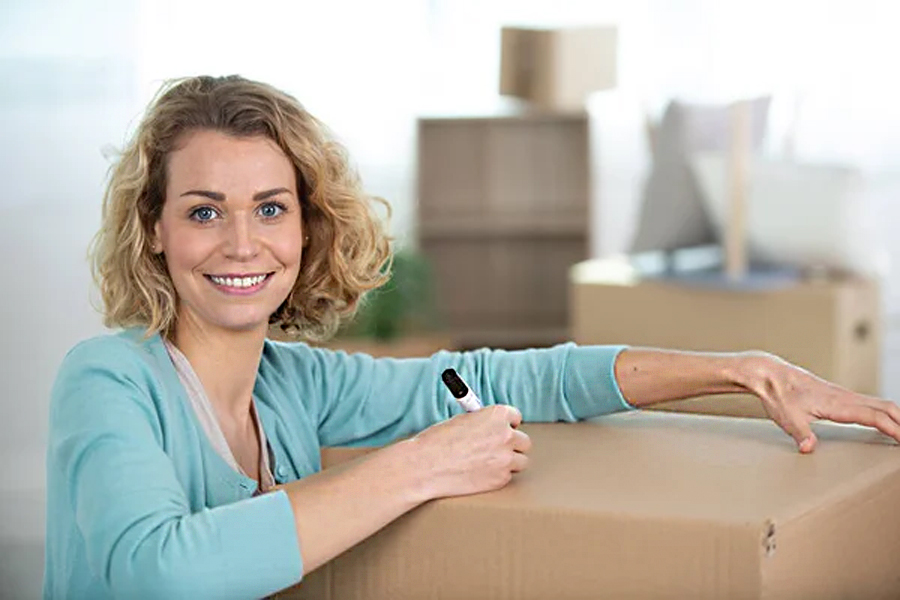 A woman using the same box for disassembled garage items