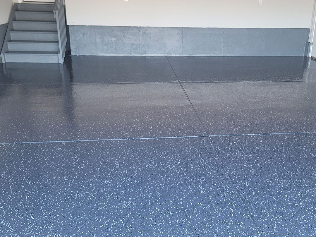 Impressive garage floor with a safe and organic floor coating in North Atlanta GA, achieving a flawless and eco-friendly transformation.
