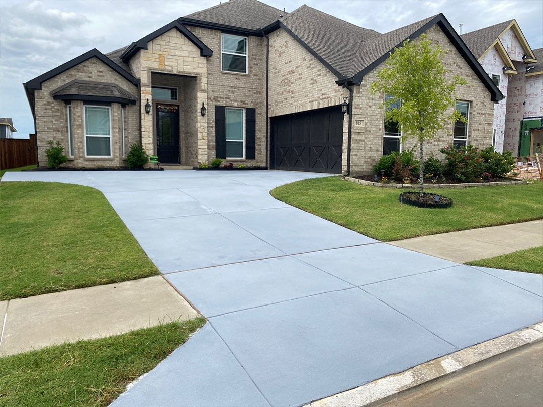 Revitalized driveway adorned with eco-friendly floor coating by Lifetime Green Coatings, showcasing sustainable beauty and protection.