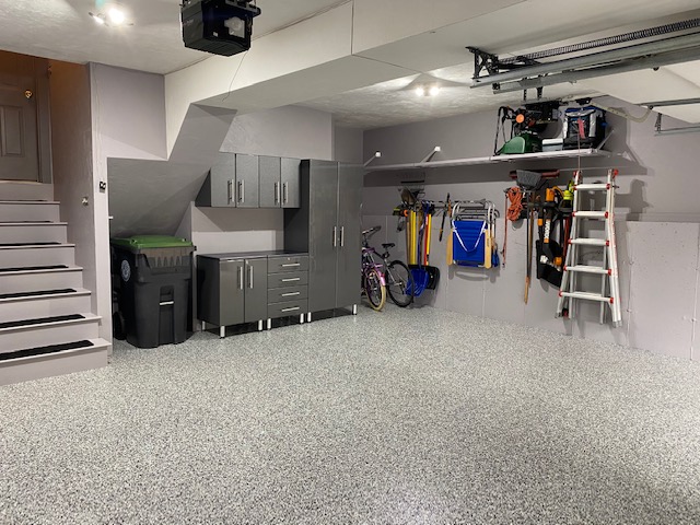 finished garage with storage cabinets